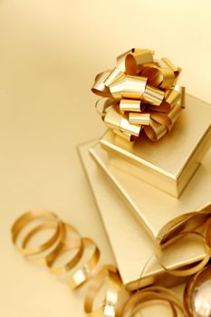 golden christmas gifts on gold background 