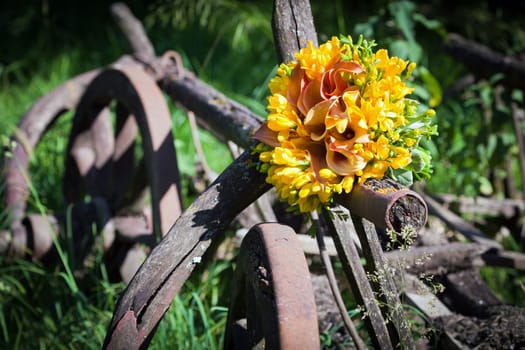Wedding bouquet with fresia flowers on a vintage cart