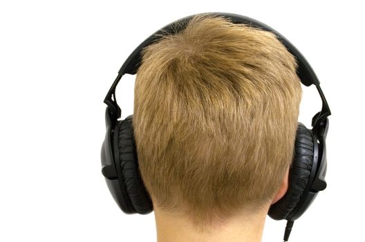 Young boy wearing headphones. Isolated on a white background.