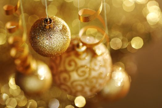 golden christmas balls on bokeh background