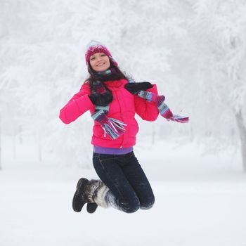 winter women jump in snow