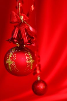  christmas balls on red satin background