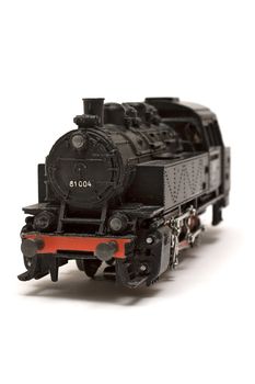 Black locomotive miniature isolated on a white background.