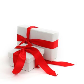 white christmas gift with red ribbon