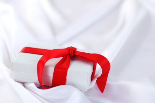  christmas gift on white silk background
