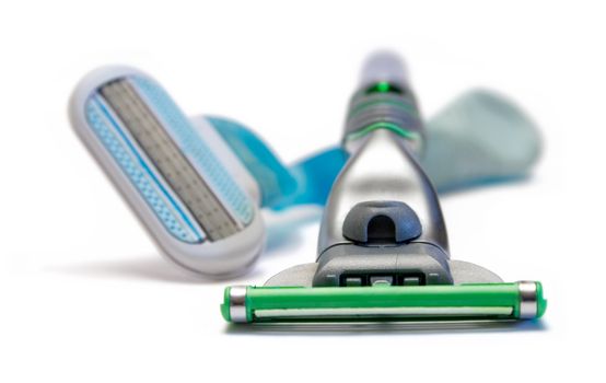 Blue and green razor isolated on a white background.