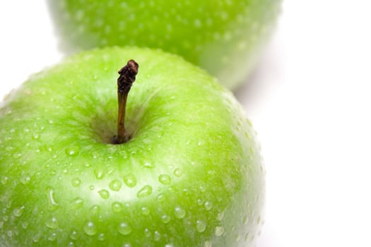Water drops on green granny smith apples.