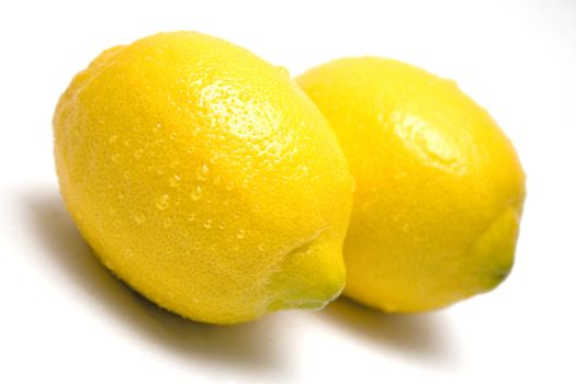 Wet lemons isolated on a white background.