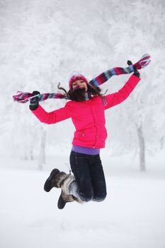 winter women jump in snow