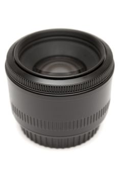 Black prime lens isolated on a white background.