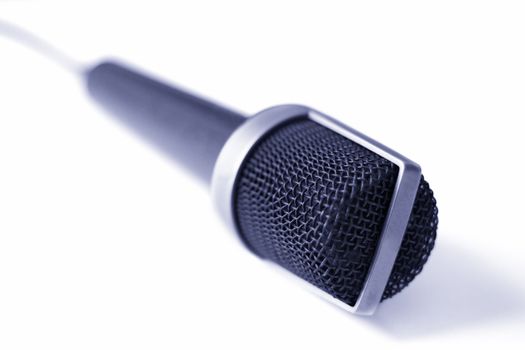 Microphone isolated on a white background. Shallow depth of field.