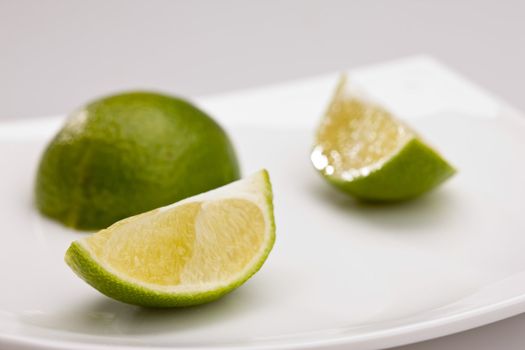 food series: tasty green sliced lime on plate
