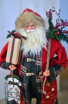 Santa Claus doll with a gift in his hand