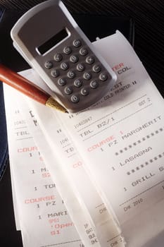 stock image of the rolled of paper and calculator