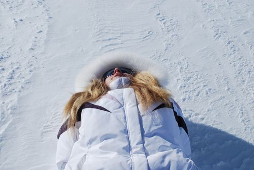 woman lying on a snow