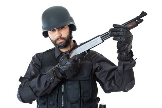 a swat agent wearing a bulletproof vest and aiming with a gun
