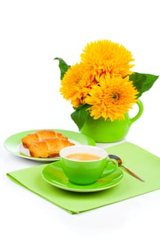 Fresh coffee and tasty croissant and sunflowers, on the white background