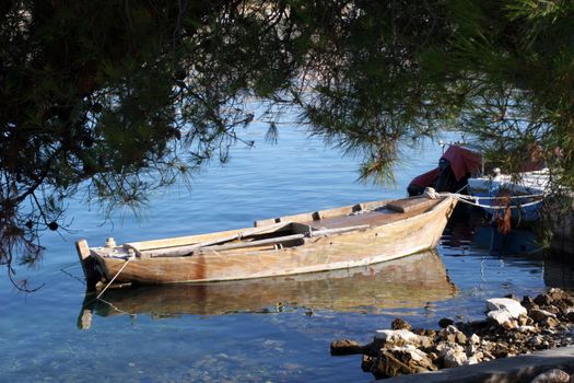 A wooden rowing boat tide down