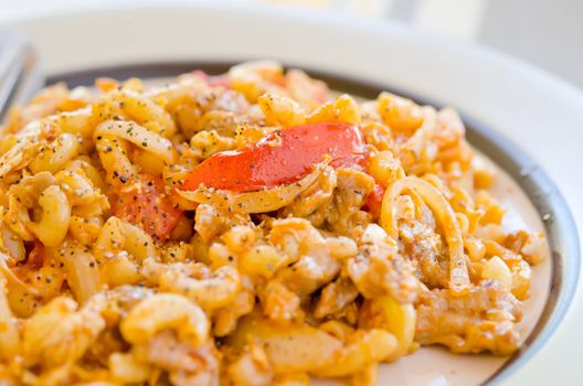 a delicious macaroni and tomato sauce on dish