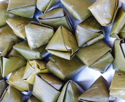 Sweet sticky rice in banana leaf package