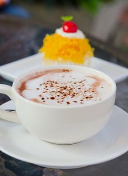 hot cappuccino  in white coffee cup