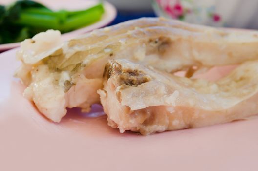 close up  fresh steam fish on pink dish
