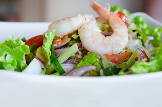 mixed  vegetable and  shrimp in white  bowl .