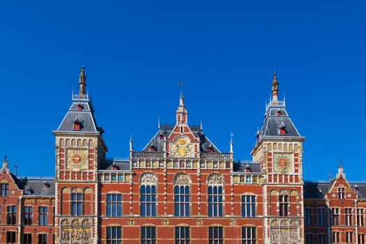 Facade of the Central Railway Station in Amsterdam, Netherlands