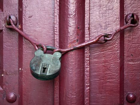 Old Lock Key on Close Red Wood Door