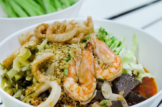 rice noodles with spicy pork and seafood sauce ,hot and spicy