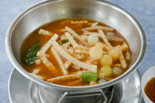 sour soup with fish eggs and vegetable , hot and spicy