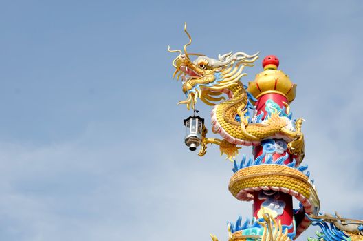 golden chinese dragon with sky background