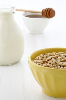 Delicious and nutritious lightly toasted honey, nuts and oats cereal with milk.