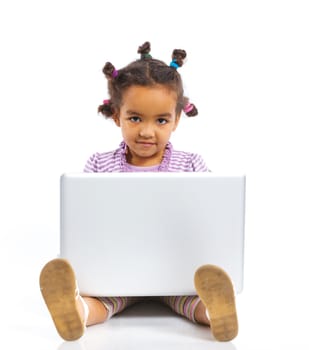 Attractive young mulatto girl using notebook computer. Isolated on white background.