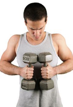 Young man excercising with dumbells