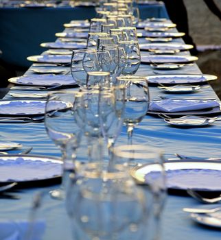 Exterior place setting for ocean side wedding celebration