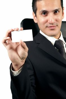 Young businessman showing a blank card