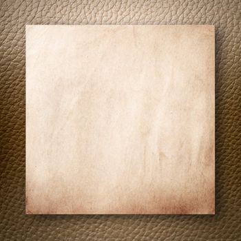 Old Paper On Light Brown Leatherette Background