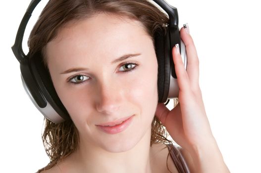 Young woman listening to music through her headphones, isolated in a whiite background
