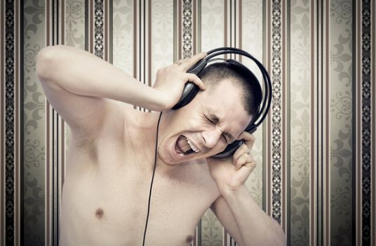 Young man enjoying music on headphones