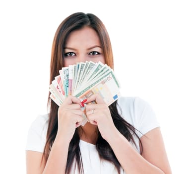 Young woman holding money in front of her face, isolated on white.