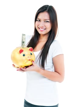 Portrait of an attractive young woman holding piggy bank over white background.