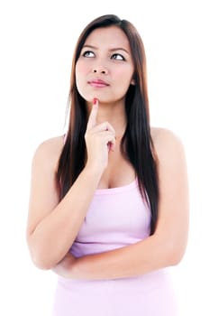 Pretty woman looking upward with finger on chin over white background.