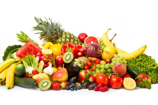 Fruits and vegetables like tomatoes, zucchini, melons, bananas and grapes arranged in a group, natural still life for healthy food 