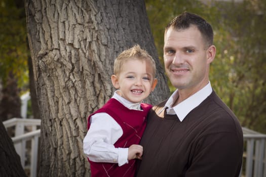 Handsome Father and Son Having Fun in the Park.