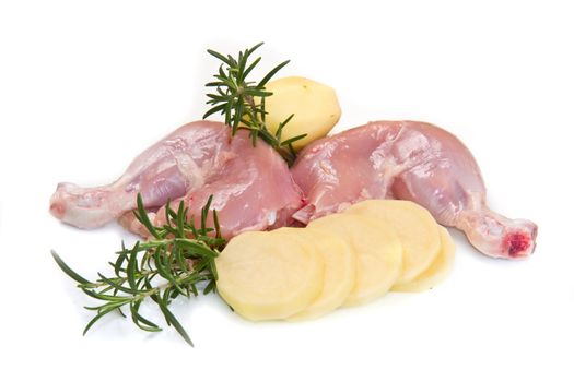 Raw chicken thighs with potatoes