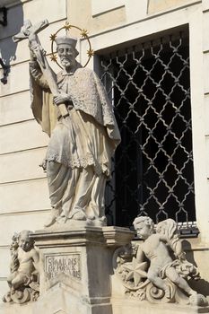 A statue of Johannes Nepomuk in front of a private catholic school in lower austria