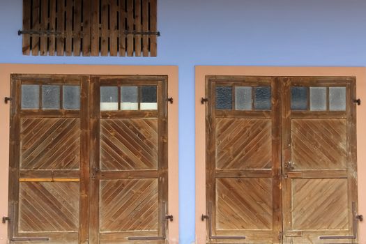 Two separate wooden garage doors close to a farm in lower-austria - beautiful contrast