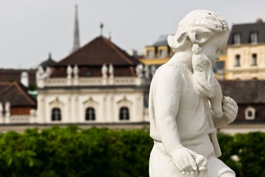 A Roman sculpture in front of castle Belvedere, Vienna, Austria