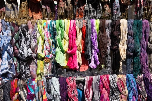 A set of scarves on a flea market with strong colors